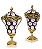 An extremely fine pair of Louis XVI gilt bronze mounted beau bleu Sèvres porcelain pot-pourri vases and covers